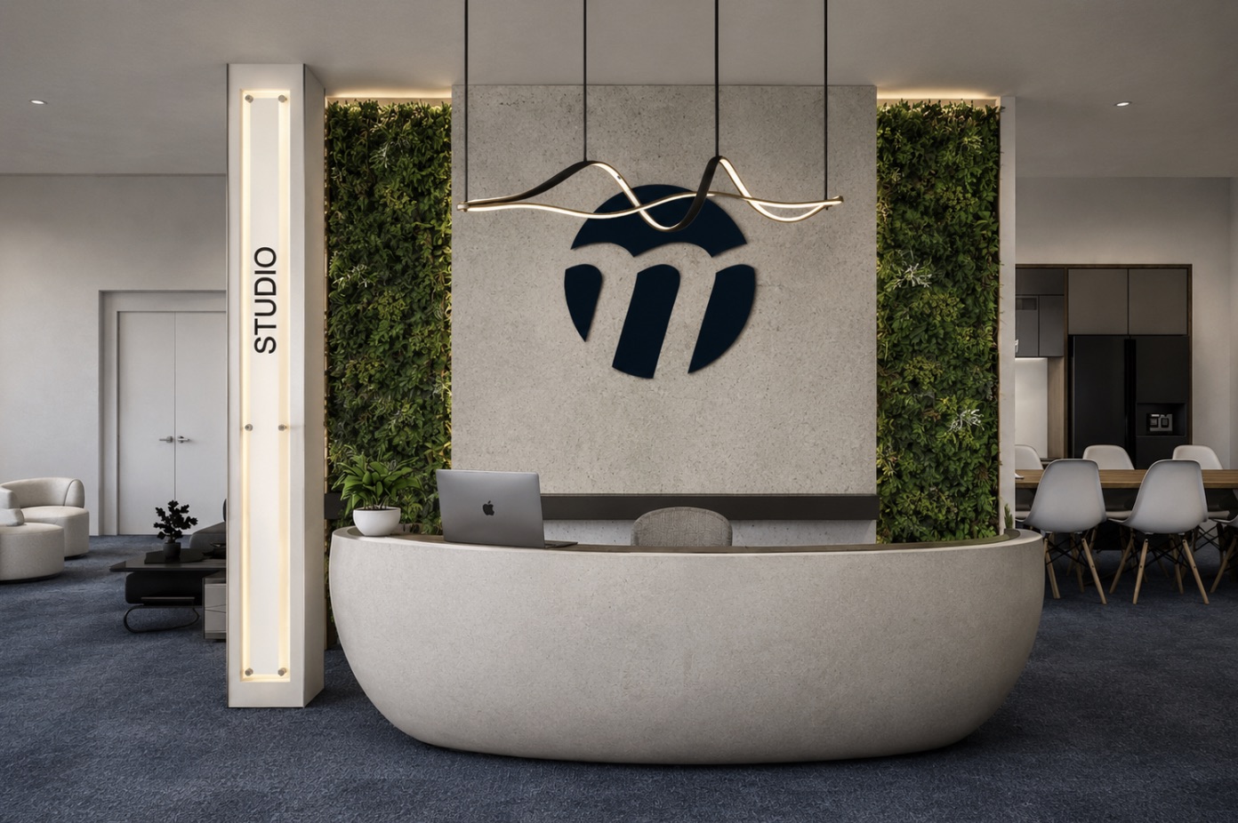 A workplace reception — a curved cast-concrete desk and the company logo on a living green wall.